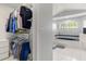 A view of the closet, bathtub, and window in the primary bathroom at 2632 Turnbull Estates Dr, New Smyrna Beach, FL 32168