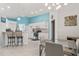 Bright kitchen features stainless steel appliances, white cabinets, and a breakfast bar at 2632 Turnbull Estates Dr, New Smyrna Beach, FL 32168
