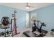 Bright workout room with ceiling fan, exercise bike, and inversion table at 2632 Turnbull Estates Dr, New Smyrna Beach, FL 32168