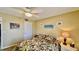 Bedroom featuring a bed and lamps at 2700 N Peninsula Ave # 322, New Smyrna Beach, FL 32169