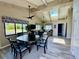 Community room with a round table, chairs, and access to the community kitchen and outdoor space at 2700 N Peninsula Ave # 322, New Smyrna Beach, FL 32169