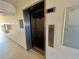 Interior view of the elevator and the mailboxes on the first floor in the building at 2700 N Peninsula Ave # 322, New Smyrna Beach, FL 32169