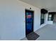Exterior shot of the condo entrance, featuring a welcome mat and the unit number at 2700 N Peninsula Ave # 322, New Smyrna Beach, FL 32169