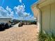 Outdoor grilling area with multiple stainless steel grills and a brick surround overlooking the marina at 2700 N Peninsula Ave # 322, New Smyrna Beach, FL 32169
