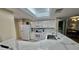 Well-lit kitchen featuring quartz countertops, white cabinetry, and modern stainless-steel appliances at 2700 N Peninsula Ave # 322, New Smyrna Beach, FL 32169
