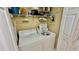 Laundry room features a stacked washer and dryer with ample shelving for storage at 2700 N Peninsula Ave # 322, New Smyrna Beach, FL 32169