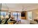 Comfortable living room with water view, ceiling fan, and access to the bedroom at 2700 N Peninsula Ave # 322, New Smyrna Beach, FL 32169