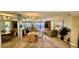 Bright living room featuring a dining area, comfortable seating, and water views at 2700 N Peninsula Ave # 322, New Smyrna Beach, FL 32169