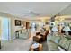 Inviting living room with comfortable seating, a ceiling fan, and views into the kitchen at 2700 N Peninsula Ave # 322, New Smyrna Beach, FL 32169