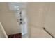 The shower features white tile walls, a grab bar, and a hanging shower caddy at 2700 N Peninsula Ave # 322, New Smyrna Beach, FL 32169