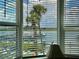 Bright window view of the harbor with palm trees at 2700 N Peninsula Ave # 322, New Smyrna Beach, FL 32169