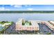 Stunning aerial view of complex with beautiful river scenery, resort pool, and parking at 2711 N Halifax Ave # 372, Daytona Beach, FL 32118