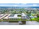Aerial view of waterfront condos, pier, pool, and coastal city skyline in the distance at 2711 N Halifax Ave # 372, Daytona Beach, FL 32118