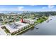 Aerial view of condos, pier, and waterfront access, blending urban and coastal living at 2711 N Halifax Ave # 372, Daytona Beach, FL 32118