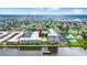 Aerial view of waterfront condos, pier, pool, and coastal city skyline in the distance at 2711 N Halifax Ave # 372, Daytona Beach, FL 32118