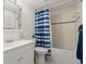 Clean bathroom features tiled floors and a bathtub with shower at 2711 N Halifax Ave # 372, Daytona Beach, FL 32118