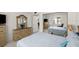 Well-lit bedroom with a mirrored closet, furnishings, and soothing color palette at 2711 N Halifax Ave # 372, Daytona Beach, FL 32118