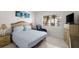 Cozy bedroom featuring neutral tones, comfortable bed, and ample natural light from a window at 2711 N Halifax Ave # 372, Daytona Beach, FL 32118
