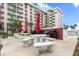 Outdoor grilling area features tables, seating, and grills for social gatherings at 2711 N Halifax Ave # 372, Daytona Beach, FL 32118