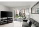 Cozy living room with view to balcony for relaxing or entertaining guests at 2711 N Halifax Ave # 372, Daytona Beach, FL 32118