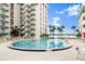 Inviting community pool with palm trees offers a relaxing outdoor space for residents at 2711 N Halifax Ave # 372, Daytona Beach, FL 32118
