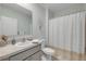 Bathroom featuring neutral paint, a single vanity, and a shower/tub combo with a decorative curtain at 2733 Neverland Dr, New Smyrna Beach, FL 32168