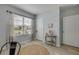 Bright bedroom featuring a jute rug, window with blinds, and coastal-inspired decor on a small table at 2733 Neverland Dr, New Smyrna Beach, FL 32168
