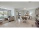 Bright dining area featuring neutral paint, tile flooring, and sliding glass door to the outside patio at 2733 Neverland Dr, New Smyrna Beach, FL 32168