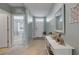 Entry hallway featuring a console table with decor, tile flooring and neutral paint at 2733 Neverland Dr, New Smyrna Beach, FL 32168