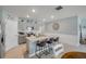 Stylish kitchen with island seating, stainless appliances, and light gray cabinetry open to the living area at 2733 Neverland Dr, New Smyrna Beach, FL 32168