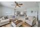 Open-concept living space with tile flooring, a comfortable seating area, and a view into the kitchen at 2733 Neverland Dr, New Smyrna Beach, FL 32168