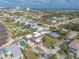 Aerial view of neighborhood, home and backyard pool with city views in background at 2900 S Peninsula Dr, Daytona Beach, FL 32118