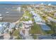 Stunning aerial view of a waterfront home with a private pool, lush landscaping, and scenic views at 2900 S Peninsula Dr, Daytona Beach, FL 32118