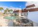 Backyard features a large pool, seating area, and lush landscaping, perfect for outdoor gatherings at 2900 S Peninsula Dr, Daytona Beach, FL 32118
