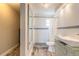 Well-lit bathroom with modern sink, tiled shower, and stylish mirror at 2900 S Peninsula Dr, Daytona Beach, FL 32118