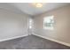 Cozy bedroom featuring neutral walls, carpeting, and window at 2900 S Peninsula Dr, Daytona Beach, FL 32118