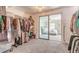Organized walk-in closet with clothing racks and view to bedroom at 2900 S Peninsula Dr, Daytona Beach, FL 32118