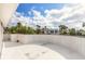 Rooftop view framed by a white wall, looking onto lush greenery and serene neighborhood views at 2900 S Peninsula Dr, Daytona Beach, FL 32118