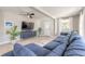 Cozy living room with a large sectional couch, ceiling fan, and plenty of natural light at 2900 S Peninsula Dr, Daytona Beach, FL 32118