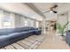 Spacious living room featuring an open floor plan, ceiling fan, and plenty of natural light at 2900 S Peninsula Dr, Daytona Beach, FL 32118