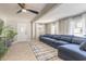 Bright living room with a sectional couch, ceiling fan, and ample natural light creates a serene atmosphere at 2900 S Peninsula Dr, Daytona Beach, FL 32118