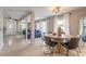 Open concept living space with a dining area, living room, and large windows allowing for great natural light at 2900 S Peninsula Dr, Daytona Beach, FL 32118