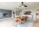 Cozy living space with a fireplace, TV, modern decor, and open view into the dining and kitchen areas at 2900 S Peninsula Dr, Daytona Beach, FL 32118