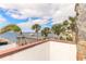Tranquil waterfront view with palm trees and a private dock, ideal for relaxation at 2900 S Peninsula Dr, Daytona Beach, FL 32118