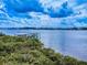Scenic waterfront property featuring a private dock and breathtaking views of the surrounding area at 2950 Sunset Dr, New Smyrna Beach, FL 32168
