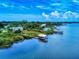 Aerial view showcasing waterfront homes, private docks, and stunning water views at 2950 Sunset Dr, New Smyrna Beach, FL 32168