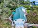 Aerial view of a home showcasing its well-manicured landscaping and a two-car garage at 2950 Sunset Dr, New Smyrna Beach, FL 32168