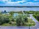 Scenic aerial view showcasing the house with water views and beautiful natural surroundings at 2950 Sunset Dr, New Smyrna Beach, FL 32168