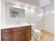 Bathroom with a brown vanity, toilet and tile flooring and neutral wall color at 2950 Sunset Dr, New Smyrna Beach, FL 32168