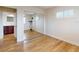 Bedroom with closet, wood floors, shuttered windows, and entry to ensuite bathroom at 2950 Sunset Dr, New Smyrna Beach, FL 32168